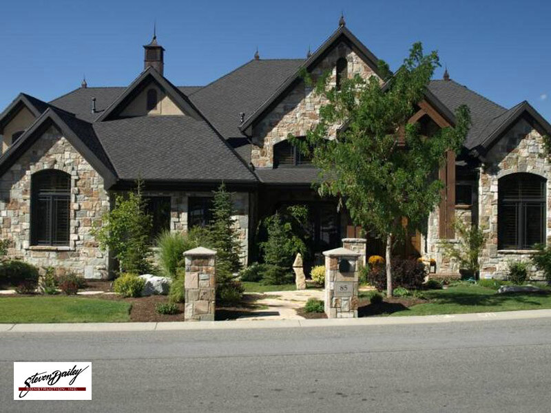 Asphalt shingle roof on a stone residence